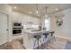 Contemporary kitchen with white cabinetry, granite countertops, and stainless steel appliances at 3870 Ivy Cottage Dr, Snellville, GA 30039