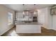 Kitchen island featuring a granite countertop and gray cabinets at 3870 Ivy Cottage Dr, Snellville, GA 30039