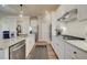 Well-appointed kitchen featuring stainless steel appliances, white cabinets, and large island at 3870 Ivy Cottage Dr, Snellville, GA 30039