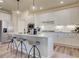 Modern kitchen featuring white cabinetry, stainless steel appliances, and a large island at 3870 Ivy Cottage Dr, Snellville, GA 30039