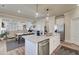 Modern kitchen island with granite countertops and stainless steel appliances and an open floor plan at 3870 Ivy Cottage Dr, Snellville, GA 30039