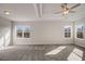 Spacious main bedroom with tray ceiling, plush carpet, and lots of natural light at 3870 Ivy Cottage Dr, Snellville, GA 30039