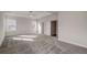 Spacious main bedroom with tray ceiling, plush carpet, and lots of natural light at 3870 Ivy Cottage Dr, Snellville, GA 30039