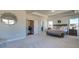 Spacious main bedroom with a tray ceiling, shiplap accent wall, and ensuite bathroom access at 3870 Ivy Cottage Dr, Snellville, GA 30039