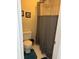 Bathroom with grey shower curtain with a showerhead, toilet, and small floor mat at 8740 Roswell Rd # 5G, Sandy Springs, GA 30350