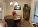 Dining room with wood table, chandelier, and views of the kitchen at 8740 Roswell Rd # 5G, Sandy Springs, GA 30350