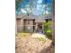 Exterior of a two-story condo featuring wood siding and a landscaped entrance at 8740 Roswell Rd # 5G, Sandy Springs, GA 30350