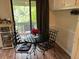 Charming kitchenette with table for two and balcony view at 8740 Roswell Rd # 5G, Sandy Springs, GA 30350