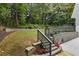 The backyard has multiple tiers and garden areas at 95 Lakeshore Ne Cir, Marietta, GA 30067
