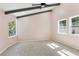 Bright bedroom with vaulted ceiling, wood beams, neutral carpet, and natural lighting at 95 Lakeshore Ne Cir, Marietta, GA 30067