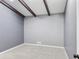 Cozy bedroom featuring neutral carpet, gray walls, and a dark ceiling beam at 95 Lakeshore Ne Cir, Marietta, GA 30067