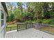 Large deck with a view of the landscaped backyard at 95 Lakeshore Ne Cir, Marietta, GA 30067