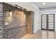 Chic entryway with a textured brick wall, modern lighting, and contemporary doors at 95 Lakeshore Ne Cir, Marietta, GA 30067