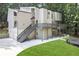 Stylish two-story home with a modern exterior, deck, and well-maintained landscaping at 95 Lakeshore Ne Cir, Marietta, GA 30067