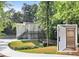 Home exterior and home elevator, complete with a private wooded lot at 95 Lakeshore Ne Cir, Marietta, GA 30067