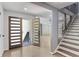 Bright and airy foyer with modern doors, staircase, and open floor plan at 95 Lakeshore Ne Cir, Marietta, GA 30067
