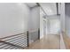 Upstairs hallway with modern railing and views of the front of the property at 95 Lakeshore Ne Cir, Marietta, GA 30067