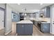 Bright kitchen features modern appliances, gray cabinetry, white countertops, and an island at 95 Lakeshore Ne Cir, Marietta, GA 30067