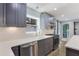 Updated kitchen features gray cabinets, stainless steel appliances, and stylish white countertops at 95 Lakeshore Ne Cir, Marietta, GA 30067