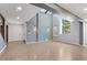 Open living space with high ceilings, exposed beams, hardwood floors, and modern lighting at 95 Lakeshore Ne Cir, Marietta, GA 30067