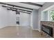Expansive living room features a vaulted ceiling with beams, recessed lighting, and a modern fireplace at 95 Lakeshore Ne Cir, Marietta, GA 30067