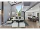 Open concept living room with high ceilings, large windows, seating area, and dining space at 95 Lakeshore Ne Cir, Marietta, GA 30067