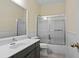 Bathroom with tile flooring, modern vanity, and shower-tub combo at , Woodstock, GA 30189