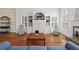 Bright living room with vaulted ceiling, fireplace, hardwood floors, and built-in shelving at 207 Bent Oak Ln, Woodstock, GA 30189