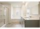 Bathroom featuring dual sinks, tub, shower with tile and a large window at 288 Highgrove Way, Dallas, GA 30157