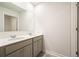 Neutral bathroom features double sink vanity with gray cabinets and tile floors at 288 Highgrove Way, Dallas, GA 30157