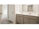 Modern bathroom featuring a double sink vanity, gray cabinets and tile flooring at 288 Highgrove Way, Dallas, GA 30157