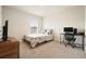 Bright bedroom features plush carpet, a large window, and contemporary furnishings at 288 Highgrove Way, Dallas, GA 30157