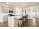 Modern kitchen with granite countertops, stainless steel appliances, and a stylish island with barstool seating at 288 Highgrove Way, Dallas, GA 30157