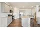 Well-lit kitchen featuring stainless steel appliances, granite counters, and a breakfast bar with seating at 288 Highgrove Way, Dallas, GA 30157