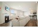 Bright living room featuring a fireplace, modern decor, and an open layout with seamless flow into the kitchen at 288 Highgrove Way, Dallas, GA 30157