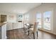 Cozy living space adjacent to the kitchen features a dining area with French doors and plenty of natural light at 288 Highgrove Way, Dallas, GA 30157