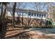 The backyard and the back of the home, as seen from the pool at 3780 Clubview Se Ct, Conyers, GA 30094