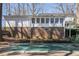 The backyard and the back of the home, as seen from the pool at 3780 Clubview Se Ct, Conyers, GA 30094