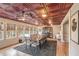 Spacious dining room featuring a textured ceiling, large table, and plenty of natural light from multiple windows at 3780 Clubview Se Ct, Conyers, GA 30094