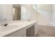 Bright bathroom featuring double sinks, white countertops, and a separate bathtub and shower at 8237 Eastshore Dr, Union City, GA 30291