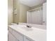 Bathroom featuring a single sink with white countertop, cabinet space, and neutral paint at 8237 Eastshore Dr, Union City, GA 30291