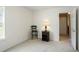 Neutral bedroom with small side table, neutral carpet, and plenty of sunlight at 8237 Eastshore Dr, Union City, GA 30291