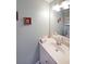 Neutral toned bathroom with a single sink vanity and decorative accents at 942 Fairmont Park Dr, Dacula, GA 30019