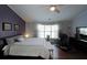 Bedroom featuring hardwood flooring and an abundance of natural light from large window at 942 Fairmont Park Dr, Dacula, GA 30019