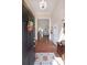 Inviting foyer with hardwood floors, a decorative chandelier, and an open view to the living space at 942 Fairmont Park Dr, Dacula, GA 30019