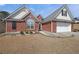 Lovely brick home featuring manicured landscaping, a two-car garage, and a classic architectural style at 942 Fairmont Park Dr, Dacula, GA 30019