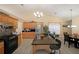 Bright kitchen with stainless steel appliances, tile backsplash, island with barstool seating and pendant lighting at 942 Fairmont Park Dr, Dacula, GA 30019