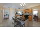 Bright kitchen showcasing an island, a rooster figurine, light-colored cabinets, and stylish pendant lighting at 942 Fairmont Park Dr, Dacula, GA 30019