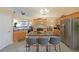 Well-lit kitchen featuring stainless steel appliances and a granite-topped island with barstool seating at 942 Fairmont Park Dr, Dacula, GA 30019