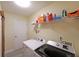 Laundry room featuring modern washer and dryer set with wire rack shelving at 942 Fairmont Park Dr, Dacula, GA 30019